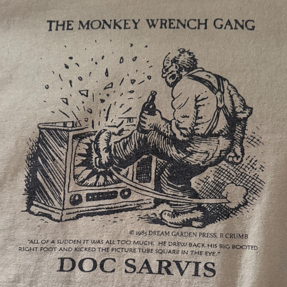 Port and Company Olive Green 'The Monkey Wrench Gang' Doc Sarvis Graphic Tee - Picture 3 of 7
